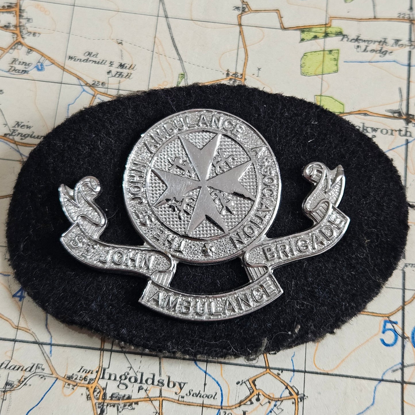 The St.John's Ambulance Association Brigade Shoulder Title Badge