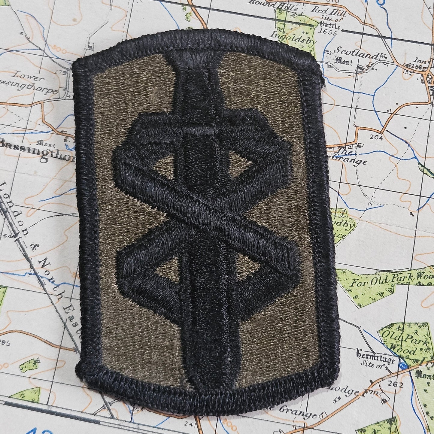 18th Medical Brigade Subdued On Olive Embroidered US Army shoulder sleeve insignia