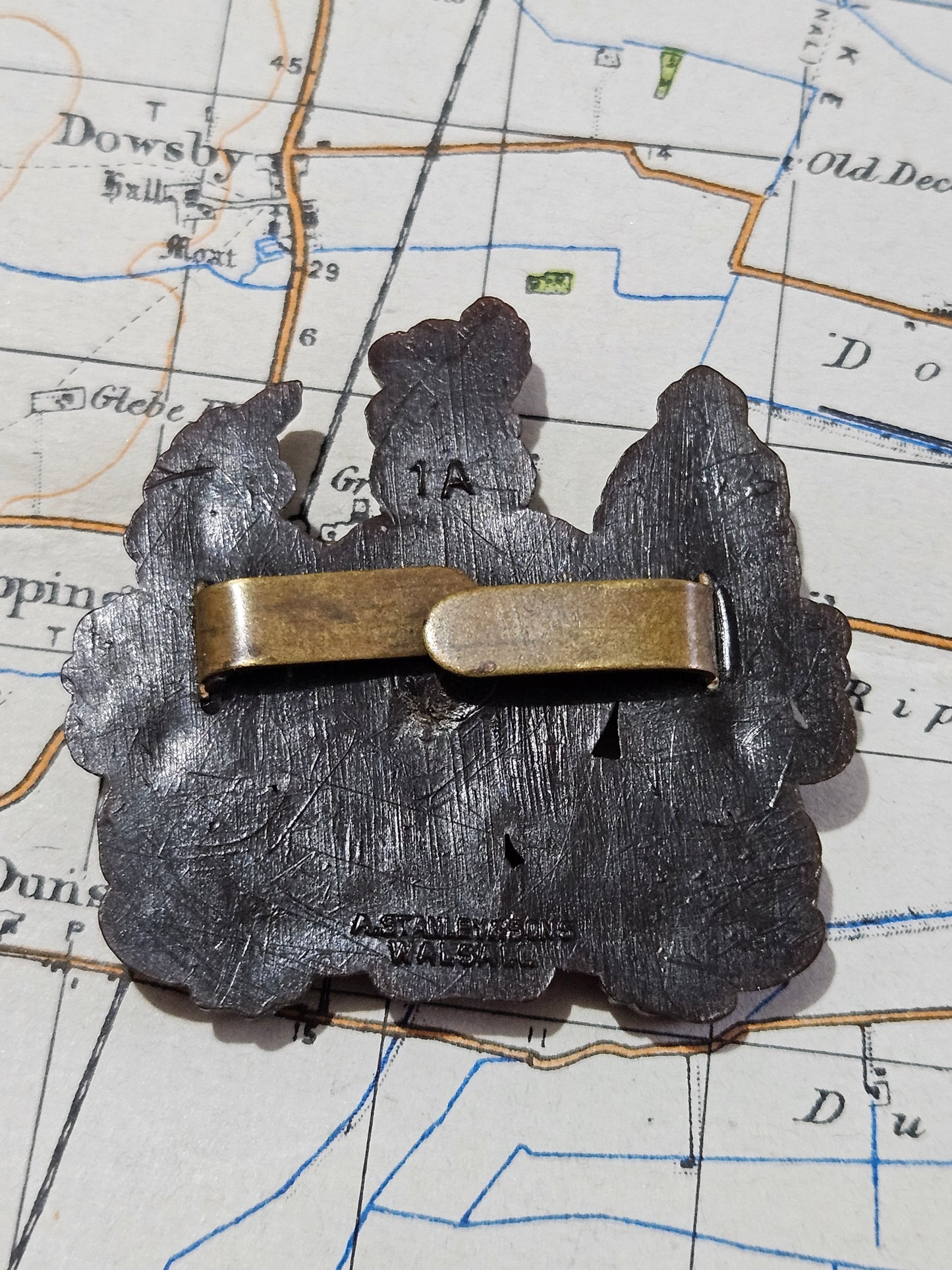 General Service Corps Brown Colour with King's Crown. Plastic Bakelite plastic cap badge