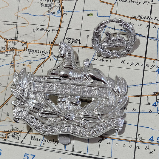 The Gloucestershire Regiment Cap Badges set, front and back.