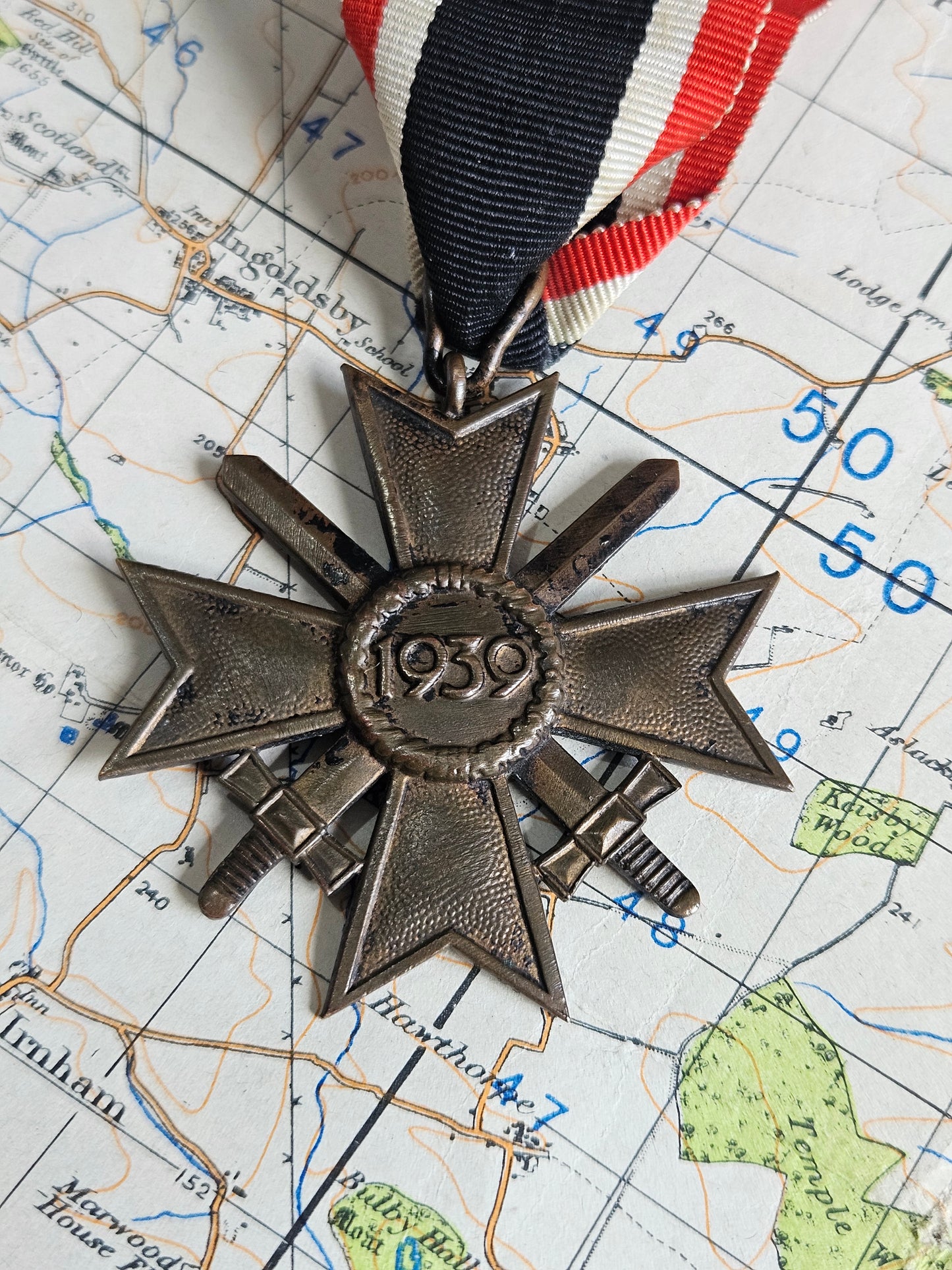 WW2 German War Merit Cross with Swords. 18 Mark for Karl Wurster