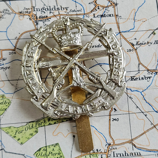 Small Arms School Corps  White Metal Cap Badge. SASC