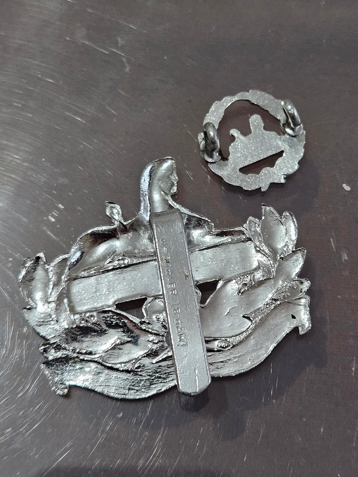 The Gloucestershire Regiment Cap Badges set, front and back.